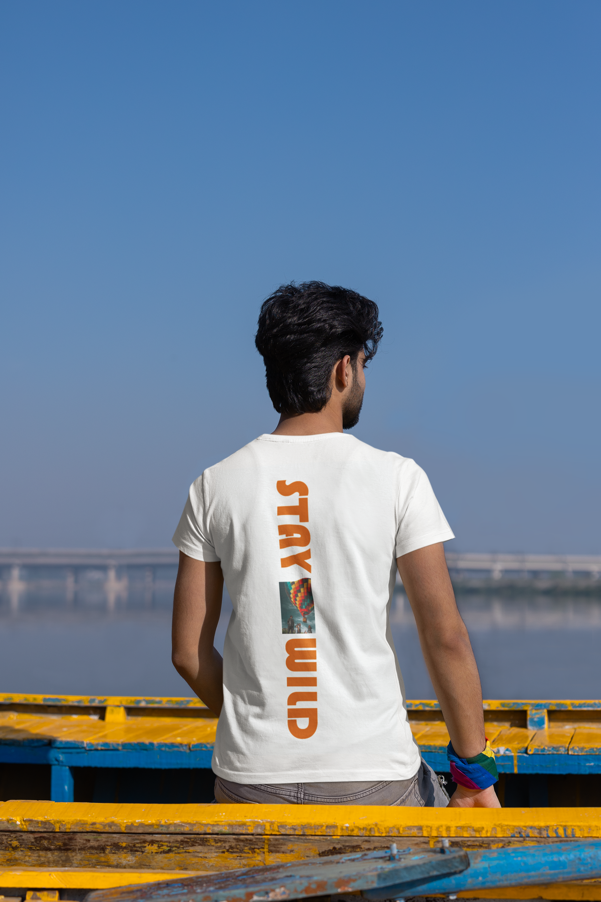 back-view-t-shirt-mockup-of-a-bearded-man-sitting-on-a-canoe-m39141
